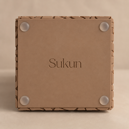 Base of Arabic calligraphy vase in Dune finish, showing non-slip pads and Sukun branding