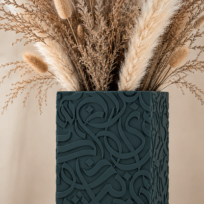 Close-up of Arabic calligraphy vase in Moss matte finish with dried pampas grass