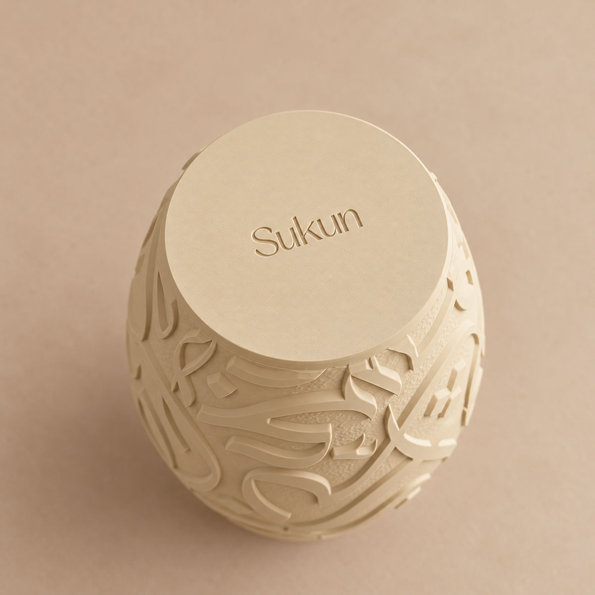 Base of round Arabic calligraphy vase in Bone finish showing the Sukun mark